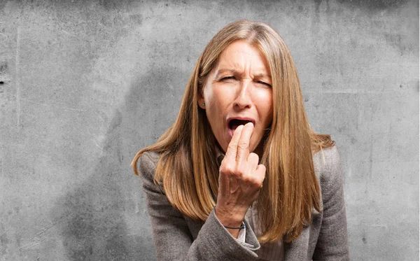 Senior beautiful woman with vomit sign — Stock Photo, Image