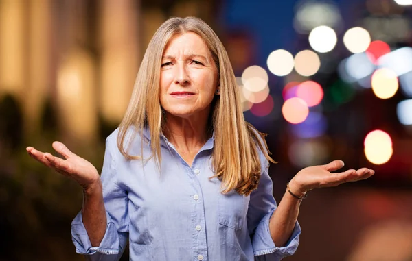 Senior beautiful woman in confused pose — Stock Photo, Image
