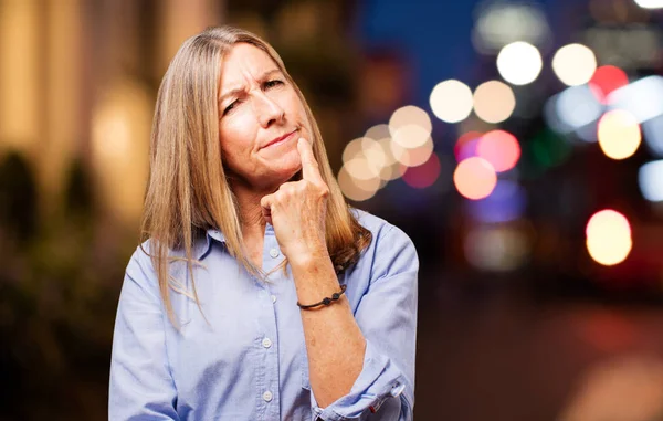 Senior beautiful woman doubting — Stock Photo, Image