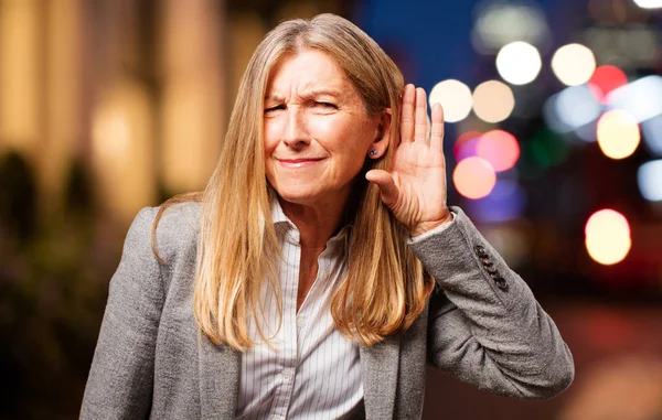 Senior beautiful woman listening — Stock Photo, Image