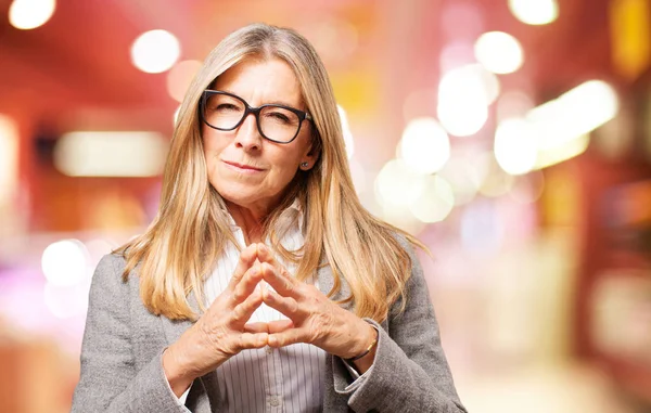 Senior beautiful woman planning something — стоковое фото