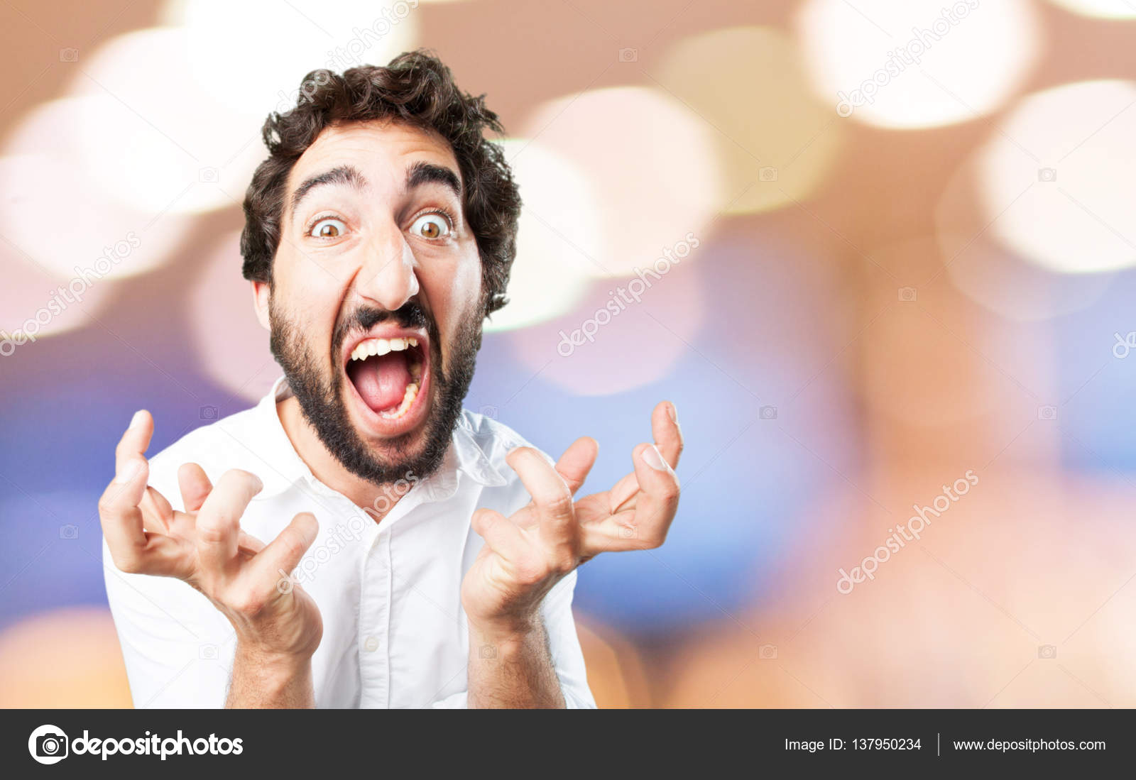 Young funny man in angry pose Stock Photo by ©kues 137950234