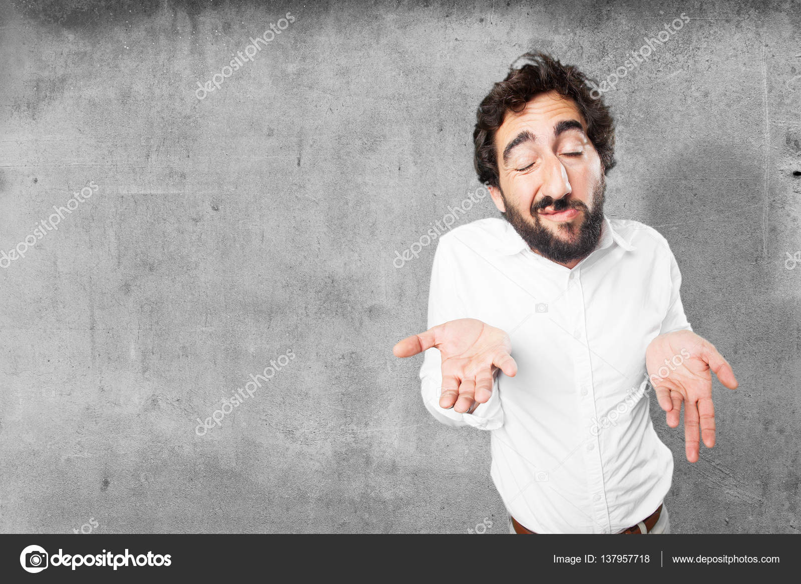Young funny man in confused pose Stock Photo by ©kues 137957718