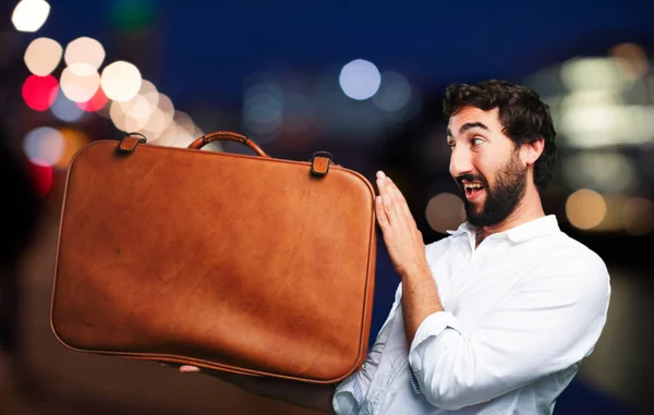 Joven divertido hombre con estuche de viaje —  Fotos de Stock