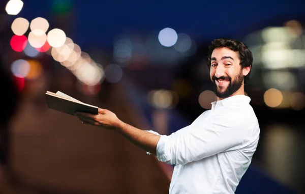 Joven divertido hombre con un libro —  Fotos de Stock