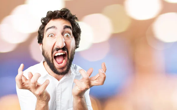 Young funny man in angry pose — Stock Photo, Image