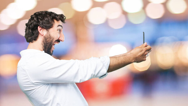 man in angry pose with mobile phone