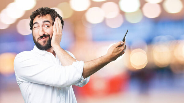 young funny man with mobile phone