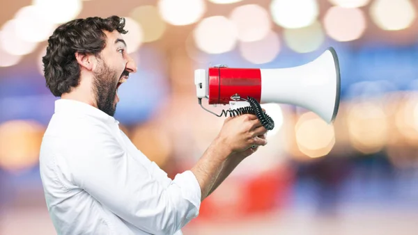 Jovem engraçado homem com megafone — Fotografia de Stock