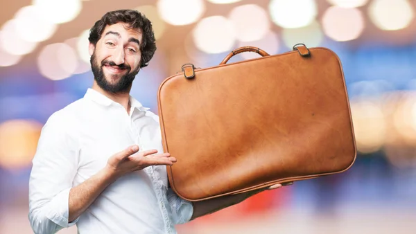 Joven divertido hombre con estuche de viaje — Foto de Stock