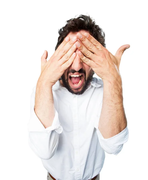 Young funny man covering eyes — Stock Photo, Image