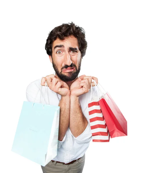 Adam alışveriş torbaları ve üzgün ifade — Stok fotoğraf