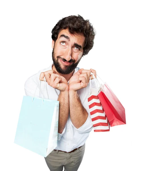 Homem com sacos de compras e expressão triste — Fotografia de Stock