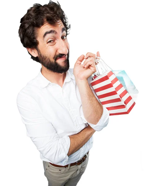 Giovane uomo divertente con borse della spesa — Foto Stock
