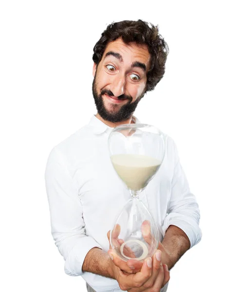 Young funny man with sand clock — Stock Photo, Image