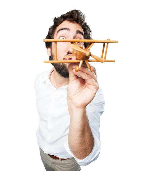 Joven divertido hombre con avión de madera — Foto de Stock