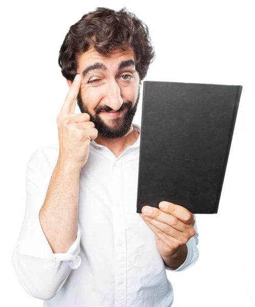 Junger lustiger Mann mit einem Buch — Stockfoto