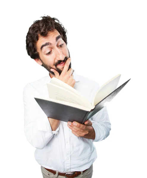 Jeune homme drôle avec un livre — Photo