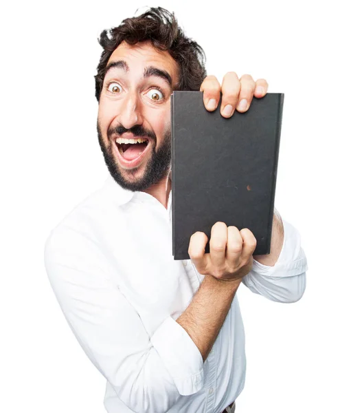 Jovem engraçado homem com um livro — Fotografia de Stock