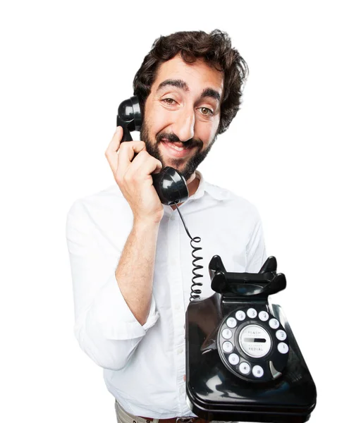 Junger lustiger Mann mit Oldtimer-Telefon — Stockfoto