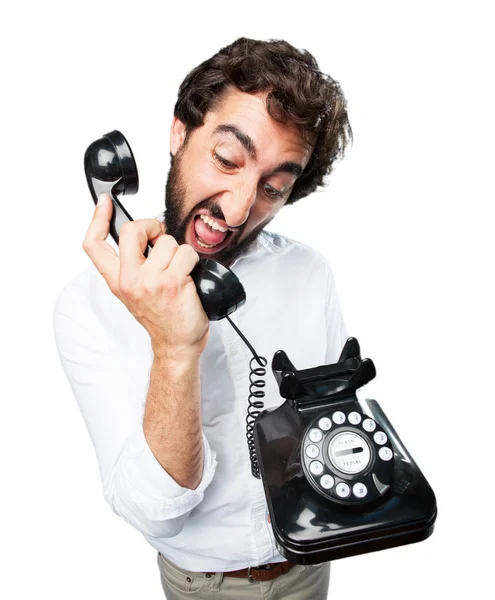 Uomo con telefono vintage ed espressione in disaccordo — Foto Stock