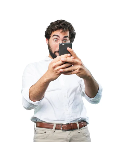 Man with mobile phone and surprise expression — Stock Photo, Image