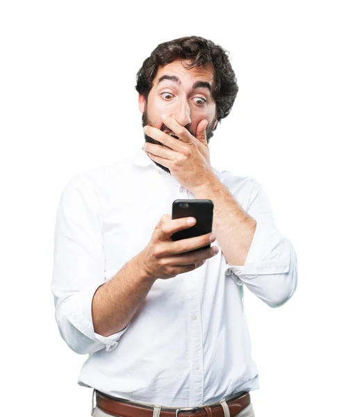 Man with mobile phone and surprise expression — Stock Photo, Image