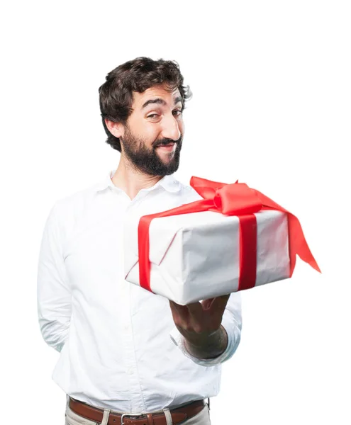 Young funny man with a gift — Stock Photo, Image