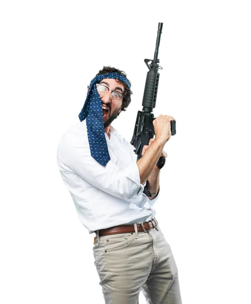 Mann med maskingevær og motstridende uttrykk – stockfoto