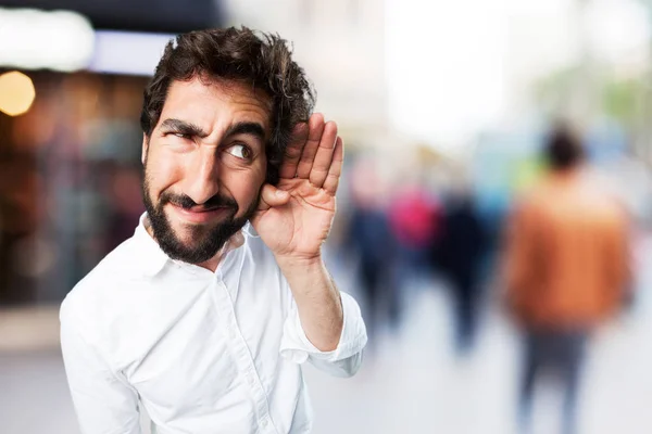 Hombre divertido escuchando con expresión en desacuerdo —  Fotos de Stock
