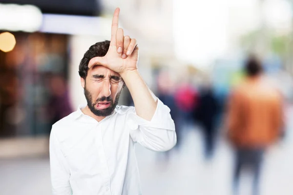 Man met verliezer teken en triest expressie — Stockfoto