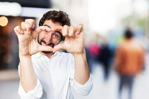 Joven divertido hombre con signo de corazón — Foto de Stock