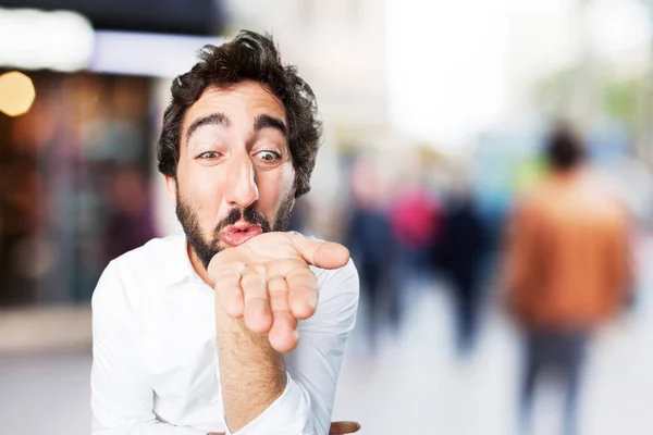 Young funny man with air kiss — Stock Photo, Image