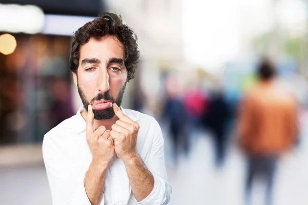 Joven divertido hombre con expresión triste —  Fotos de Stock