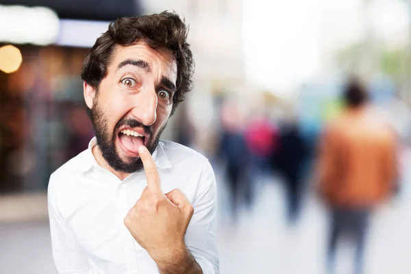 Hombre con signo de vómito y expresión en desacuerdo — Foto de Stock