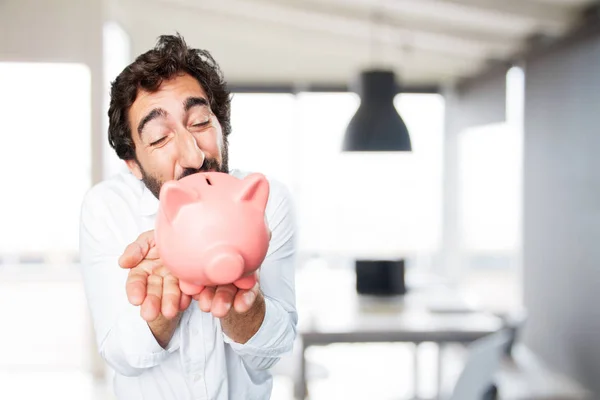 Young funny man with piggy bank — Stock Photo, Image