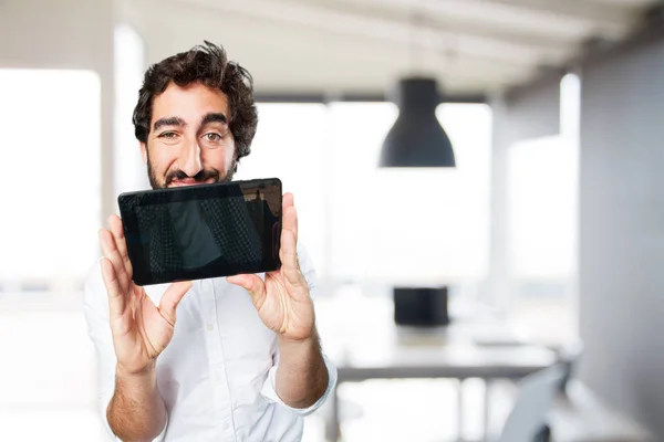 Young funny man with touch screen tablet — Stock Photo, Image