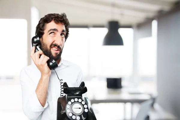 Homem com telefone vintage e expressão surpresa — Fotografia de Stock