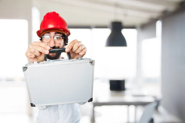 Grappige jongeman met een zaak — Stockfoto