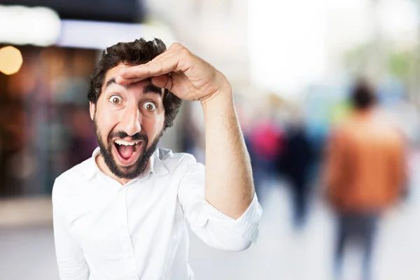 Young funny man looking far — Stock Photo, Image