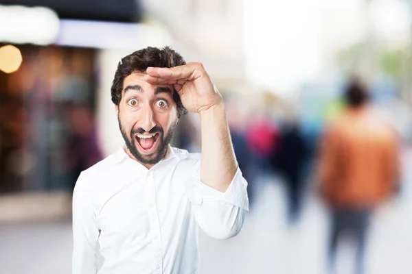 Young funny man looking far — Stock Photo, Image