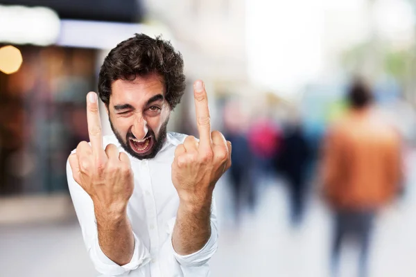 Young funny man in disagreement pose — Stock Photo, Image