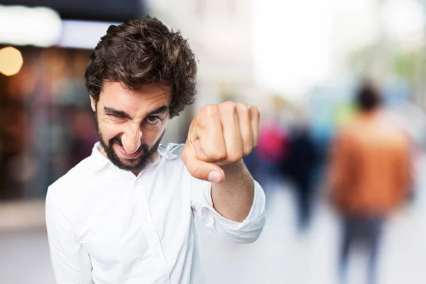 Hombre con el signo del puño y la expresión en desacuerdo —  Fotos de Stock