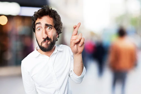 Man finger crossed with sad expression — Stock Photo, Image