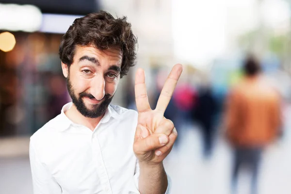 Jeune homme drôle avec des chiffres signe — Photo