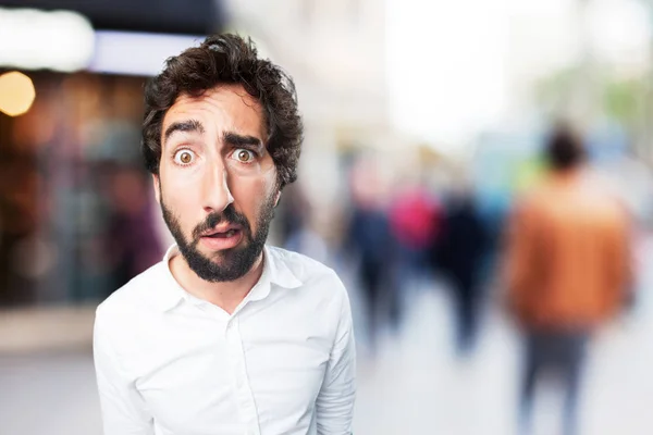 Man in confused pose with worried expression — Stock Photo, Image