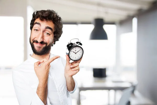 Jeune homme drôle avec horloge — Photo