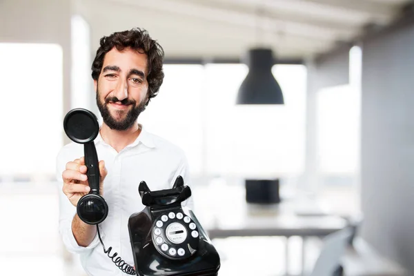 Jovem engraçado homem com vintage telefone — Fotografia de Stock