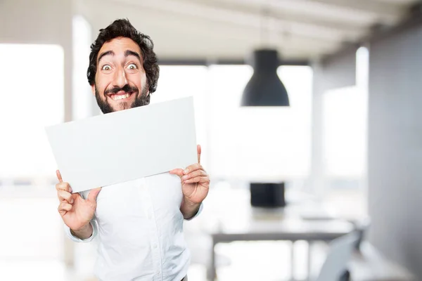 Young funny man with a placard — Stock Photo, Image