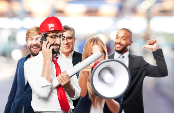 Young funny architect with mobile phone — Stock Photo, Image